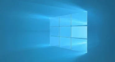 Fondo de pantalla de Windows con un diseño minimalista de cuadros en tonalidades azules