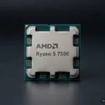 Procesador AMD Ryzen 5 7500 con el logotipo de AMD en la tapa, en primer plano sobre una superficie oscura lisa. Imagen generada con IA.