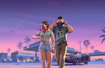283-gta-6-horarios-desbloqueo-mundial-ps5-xbox Lucia y Jason, protagonistas de Grand Theft Auto VI, con pañuelos en la cara ante una gasolinera al atardecer
