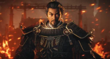 Guerrero con armadura de los Tres Reinos frente a un escenario en llamas en Wo Long 2: Wings of Ember