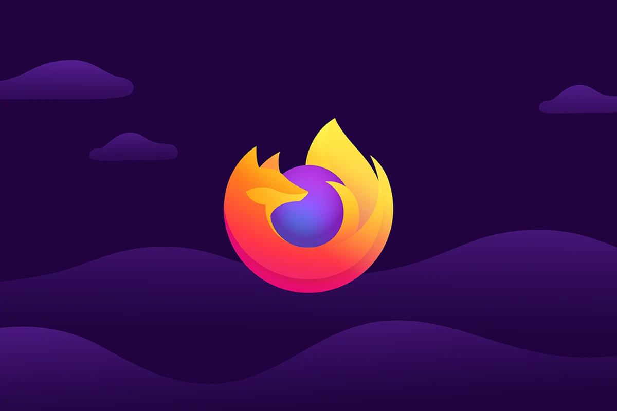 firefox-157-nova-mayor-rediseno-navegador Logotipo de Firefox sobre un fondo morado con nubes y colinas
