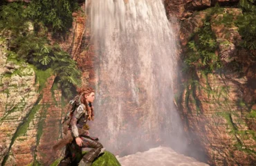Escena de videojuego con una cascada entre paredes de roca y vegetación y una protagonista en primer plano, en una imagen de AMD de FSR 4