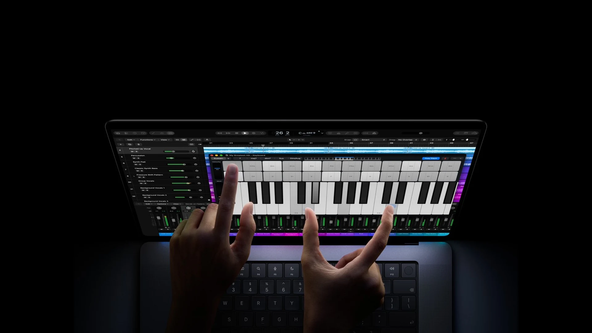 macbook-pro-pantalla-proled-xdr-control-tactil Dos manos tocan un teclado de piano en la pantalla de un MacBook Pro con pantalla PROLED XDR sobre fondo negro