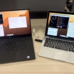 Un portátil Dell XPS y un MacBook Pro sobre una mesa de madera, los dos con el escritorio de Raspberry Pi y una memoria USB conectada al MacBook